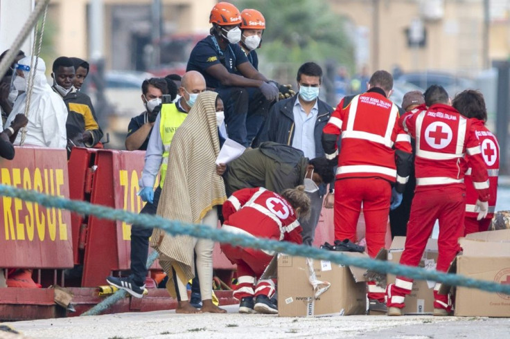 Red Cross workers helped the migrants off the Sea Eye 4, which had begged Italy to allow it to dock after carrying out multiple rescue operations