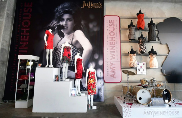 A collection of Amy Winehouse dresses and her drum set are displayed at Julien's Auctions in Beverly Hills, California on November 1, 2021, ahead of the "Property from the Life and Career of Amy Winehouse" auction to be held November 6 and 7, 2021