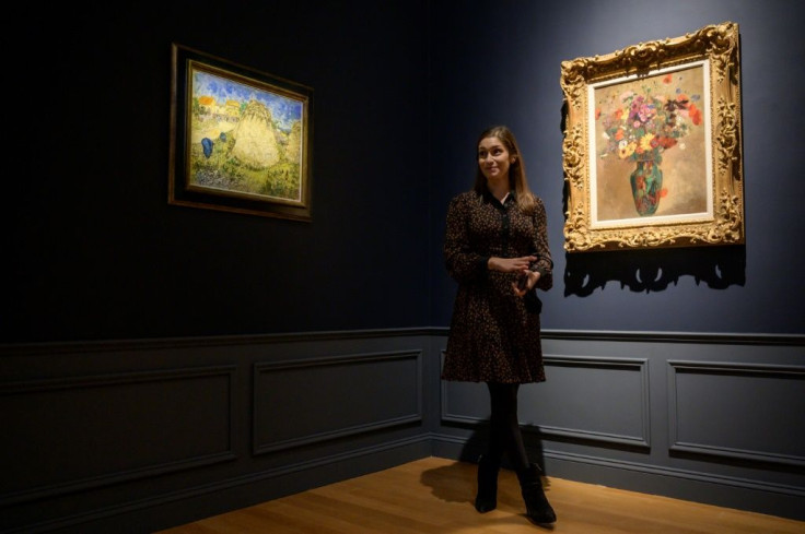 Vincent Van Gogh painting 'Meules de ble' (left) is displayed at Christie's auction house