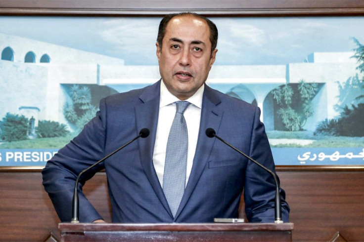 Arab League envoy Hossam Zaki, shown speaking to reporters, suggested the resignation of Lebanon's information minister was necessary