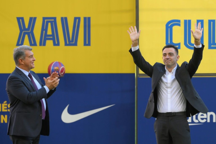 Newly-appointed Barcelona coach Xavi Hernandez (right) alongside club president Joan Laporta at Camp Nou on Monday.