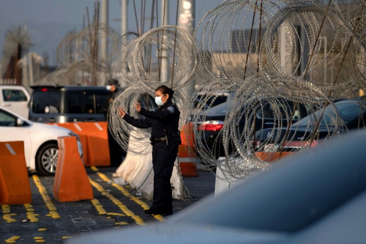 Cars and pedestrians waited in line to cross into the United States from Tijuana