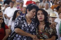 Residents take part in a minute of silence in memory of drug war victims, during a peaceful protest led by Mexican poet Javier Sicilia in Torreon