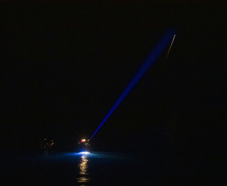 This NASA handout photo shows the SpaceX Crew Dragon Endeavour spacecraft as it lands in the Gulf of Mexico off the coast of Pensacola, Florida, November 8, 2021