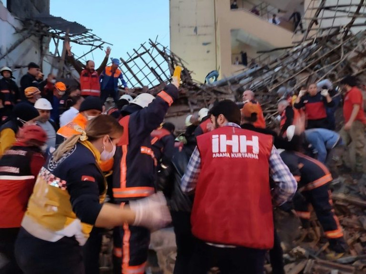 Rescue workers seeking survivors in the debris