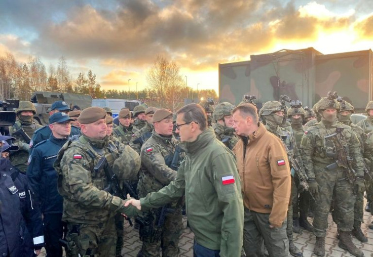 Polish PM Morawiecki met with border guards, troops and police at the scene early Tuesday