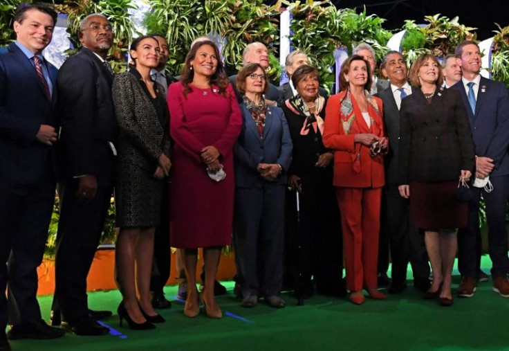 US Speaker of the House Nancy Pelosi, poses for a group photograph with US congress members, including US Representative Alexandria Ocasio-Cortez, during the COP26 UN Climate Change Conference in Glasgow