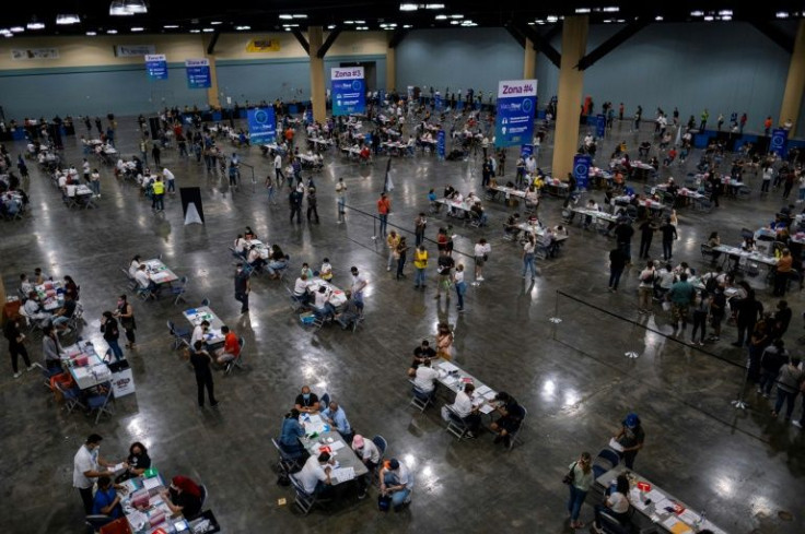 People attend the first mass vaccination event to get inoculated with Johnson & Johnson at the Puerto Rico Convention Center in San Juan in March 2021