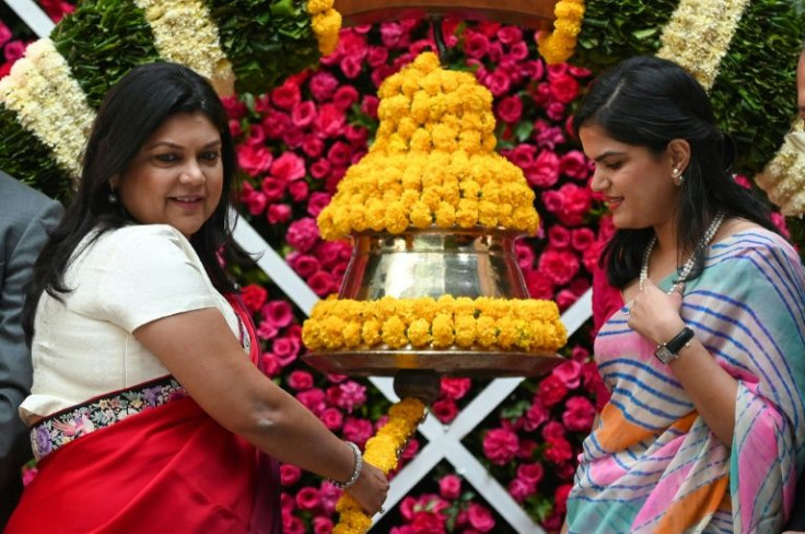Falguni Nayar (L), with daughter Advaita at her company's IPO listing ceremony, launched the ecommerce platform in 2012