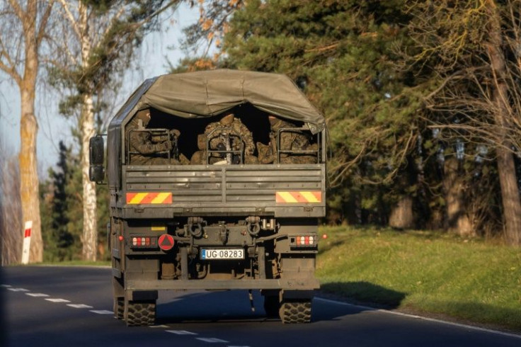 Polish military personnel travel to the Belarus border area after a surge in migrants trying to cross