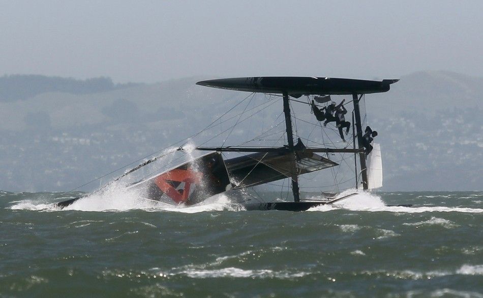 An Oracle Racing AC45 boat capsizes during an exhibition race in San Francisco Bay
