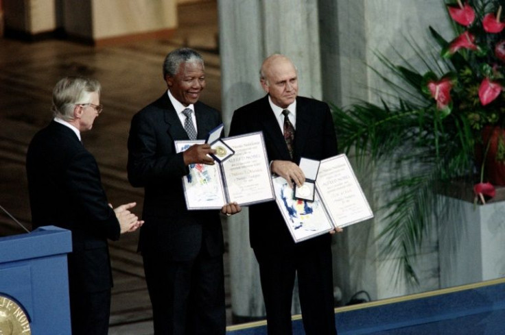 Mandela and de Klerk (R) with their joint Nobel Prizes