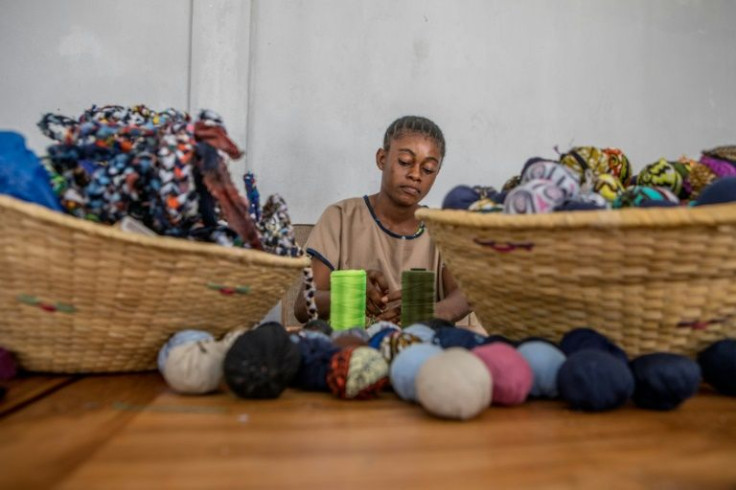 Out of piles of fabric all manner of objects take shape -- from placemats and rugs to earrings