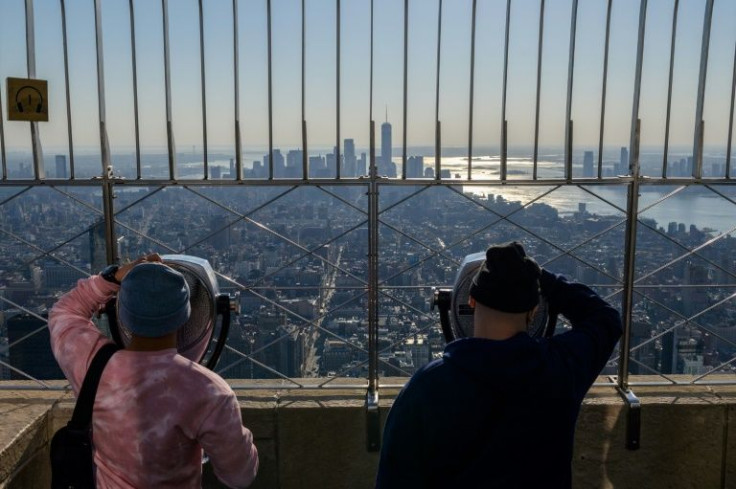 Visitors look at the view from the Empire State Building's 86th floor on November 9, 2021 in New York