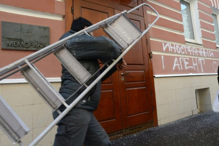 Graffiti daubed on the outside of the Memorial office in Moscow reads 'A Foreign Agent'