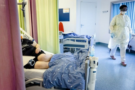 Nursing staff assist a Covid-19 patient in the nursing department of Maastricht UMC in Maastricht on November 10, 2021; coronavirus cases have soared in the Netherlands