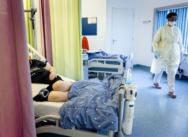 Nursing staff assist a Covid-19 patient in the nursing department of Maastricht UMC in Maastricht on November 10, 2021; coronavirus cases have soared in the Netherlands
