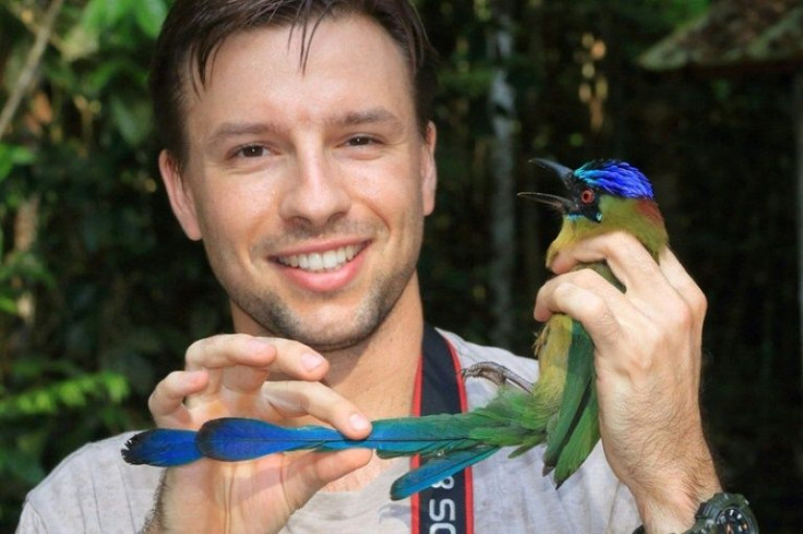 Researcher Vitek Jirinec is pictured with an Amazonian Motmot