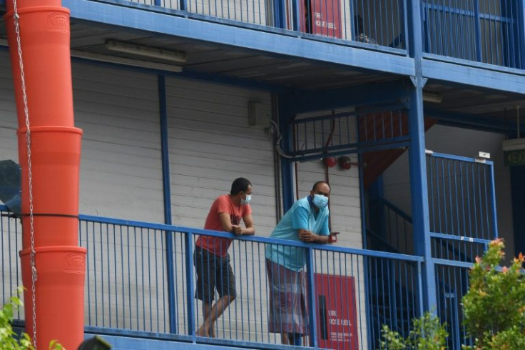 More than 300,000 migrant workers, many of them from South Asia, live in dorms in Singapore