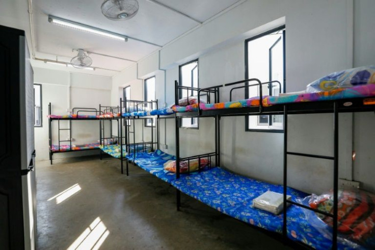 Migrant workers in Singapore are typically packed into shared rooms and sleep on bunk beds