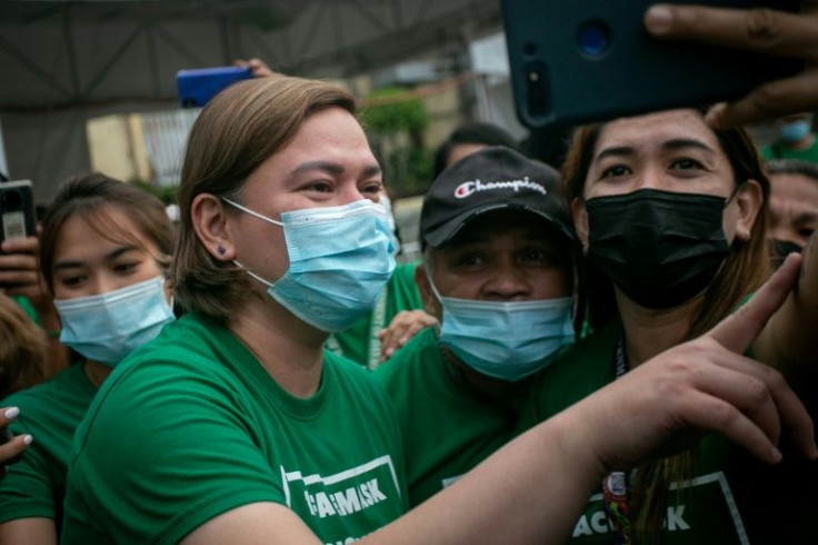 For months, Sara Duterte (L) had insisted she wanted to serve another term as Davao City mayor, even as she topped polls for the presidency