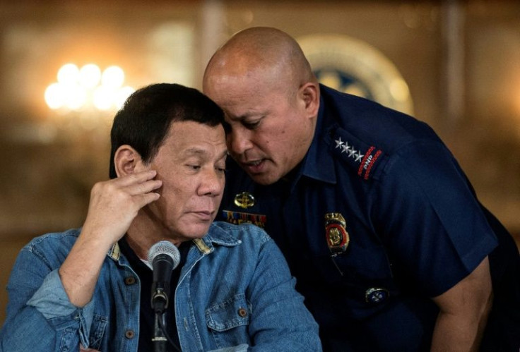 Philippine President Rodrigo Duterte (L) is constitutionally barred from seeking a second term and is facing an investigation into his deadly drug war