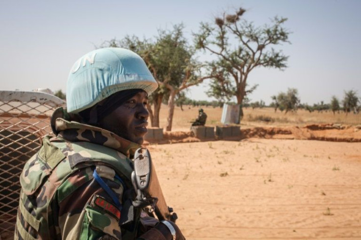 A Senegalese peacekeeper stands next to a United Nations armoured vehicle in Ogossagou