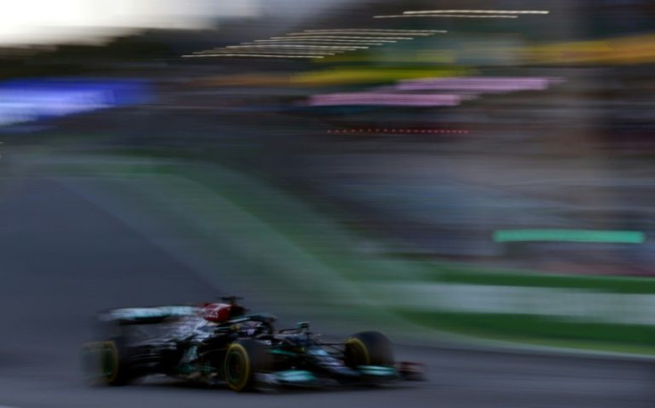 Out of my way: Lewis Hamilton powers his Mercedes from the back of the grid to fifth in the sprint race