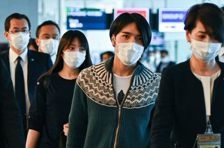 Japan's former princess Mako Komuro (2nd L) and her husband Kei Komuro (2nd R) have left for the United States
