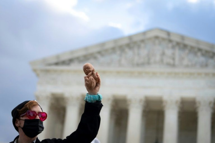 An anti-abortion demonstrator protests outside the US Supreme Court on November 1, 2021 in Washington, DC