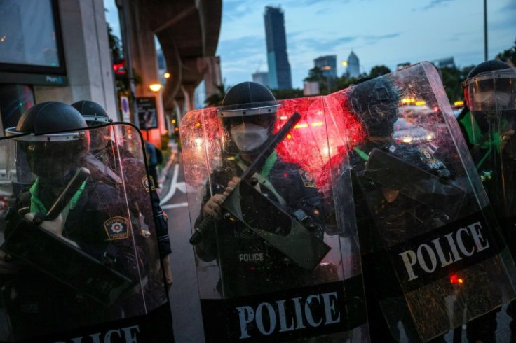 Riot police gather as protesters take part in the demonstration in Bangkok