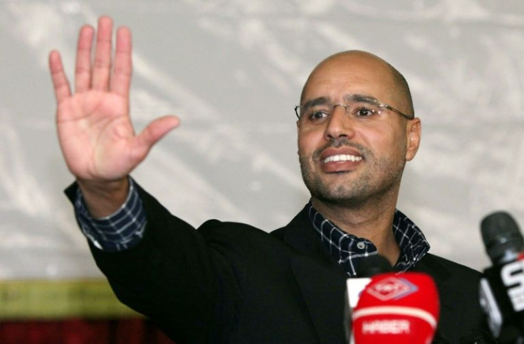 Seif al-Islam Kadhafi, son of slain Libyan dictator Moamer Kadhafi, waves during a meeting with young people in the capital Tripoli in this March 10, 2011 picture