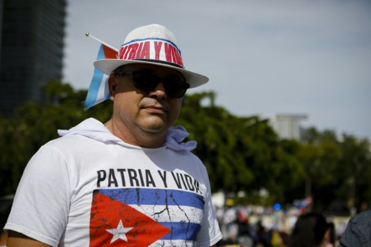Cuban-American Mariano Pujol poses for a photo on November 14, 2021 during a demonstration in Miami in support of Cuban anti-government protesters