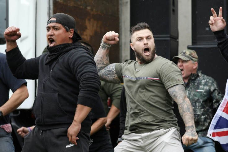 Activists perform a haka during a protest to demand an end to Covid-19 restrictions and mandatory vaccination in Christchurch on November 13, 2021.