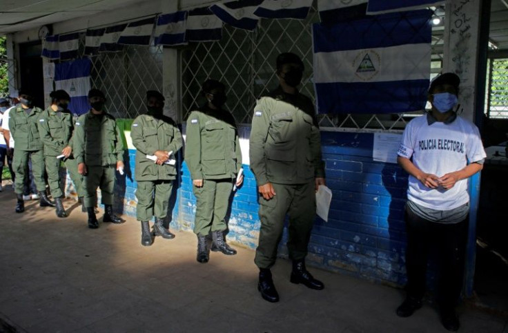 Nicaraguan soldiers wait in line to vote in the general election on November 7, 2021
