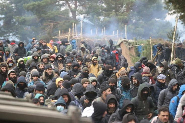 Migrants heading towards the Polish border crossing