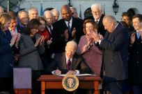 US President Joe Biden signs a $1.2 trillion infrastructure bill that he says proves bipartisan cooperation is possible