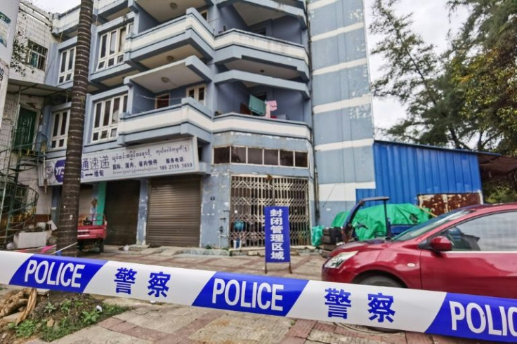 This file picture shows a building in Ruili, with access blocked by police amid a Covid scare