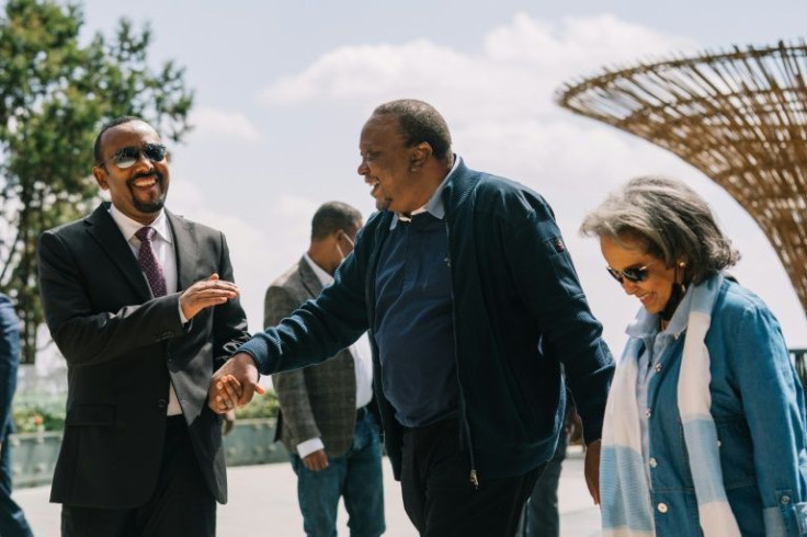 Kenyan President Uhuru Kenyatta, centre, made a surprise visit to Addis Ababa with Ethiopian Prime Minister Abiy Ahmed , left, and President Sahle-Work Zewde, right