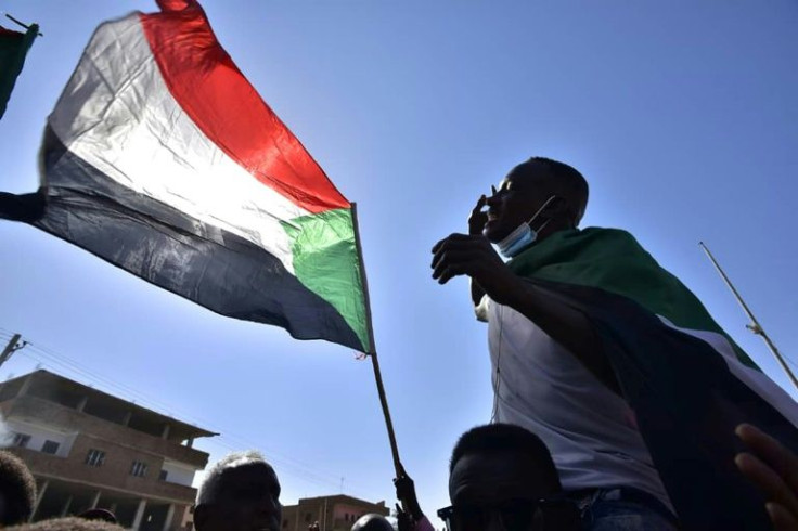 A file picture taken on November 13, 2021 shows a Sudanese man chanting slogans during protests the military coup in Khartoum
