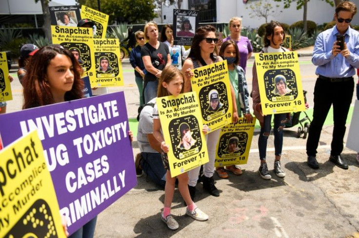 Family and friends of people who died after being poisoned by pills containing fentanyl protest near the California headquarters of Snapchat -- the social media firm has vowed to crack down on drug dealing that has proliferated on the platform