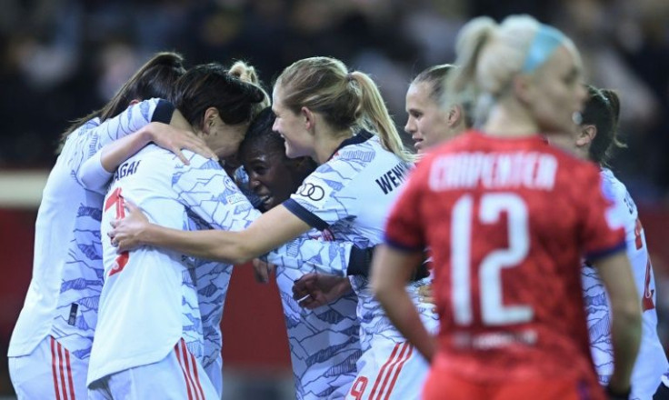 Japanese midfielder Saki Kumagai (2nd L) celebrates after scoring the winner for Bayern Munich against Lyon