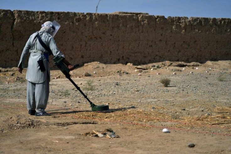 Deminers risk their lives to find the deadly traps laid during the fighting in recent months