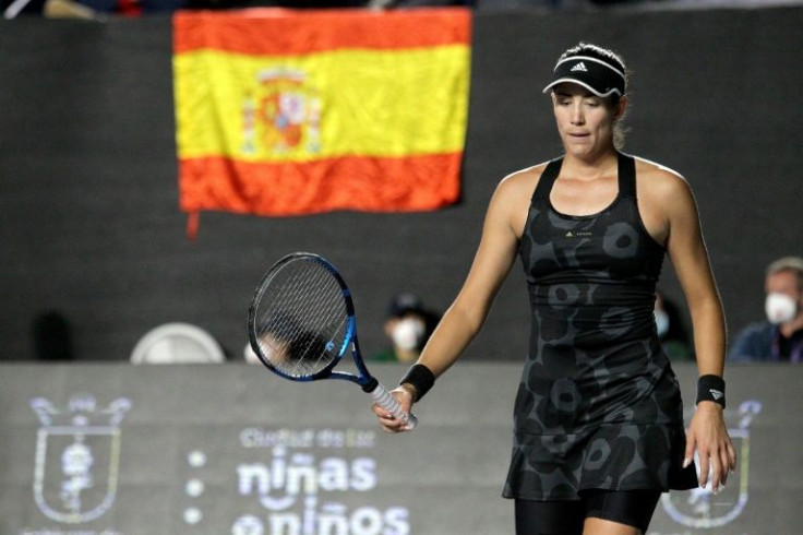 Spain's Garbine Muguruza on the way to victory over Anett Kontaveit in the championship match of the WTA Finals in Guadalajara, Mexico