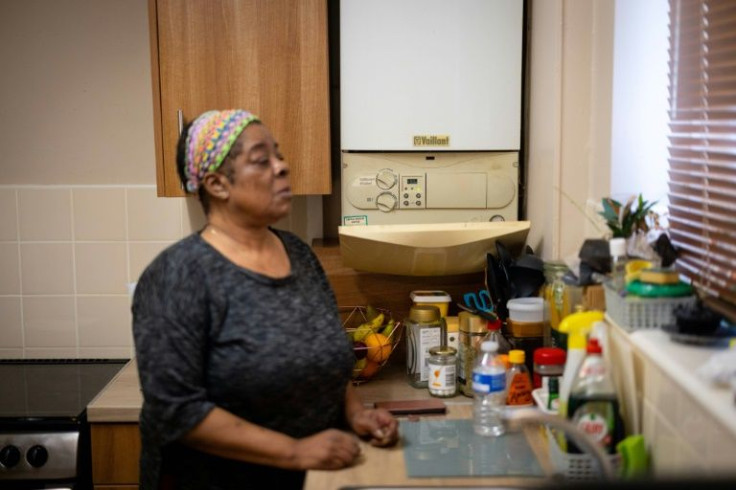 Retired social worker Doreen Thompson turns off the heat in her apartment outside London to keep her soaring energy bill down.