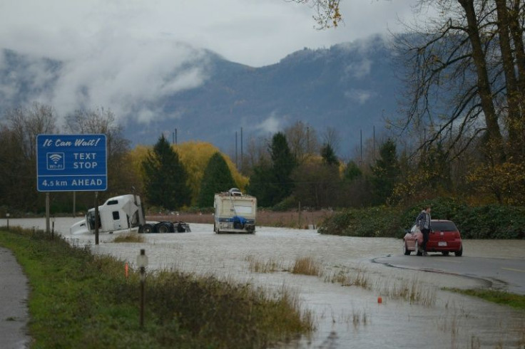 Rail and highway links to Vancouver were temporarily reopened by emergency crews clearing debris Thursday, allowing travellers stranded by mudslides from record rainfall to pass to coastal Vancouver