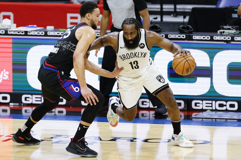 James Harden #13 of the Brooklyn Nets drives against Ben Simmons #25 of the Philadelphia 76ers