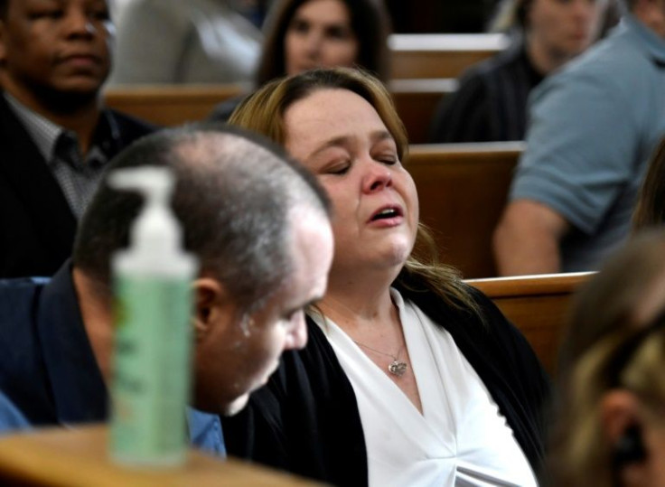 Kyle Rittenhouse's mother, Wendy Rittenhouse, reacts as her son is found not guilty