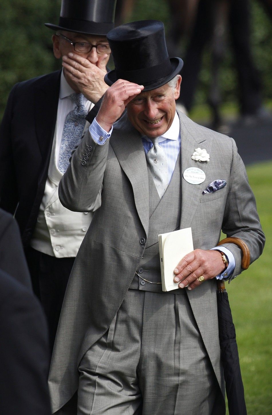 Britain039s Prince Charles lifts his hat on the first day of racing at Royal Ascot in southern England