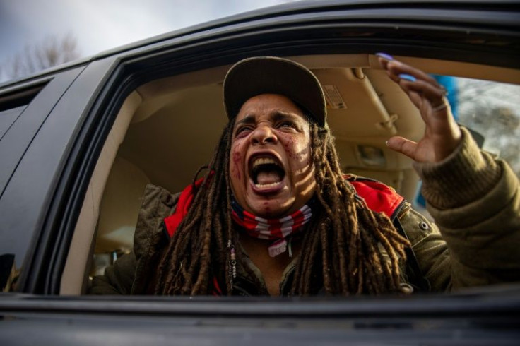 A woman reacts, in anger, to the Kyle Rittenhouse verdict outside the courthouse in Kenosha, Wisconsin